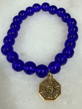 Cobalt Blue Bead Bracelet with Gold Yin Yang Charm
